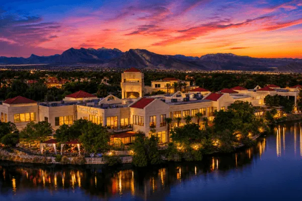 Lakeside office complex in Las Vegas at sunset with waterfront views and mountains in the background